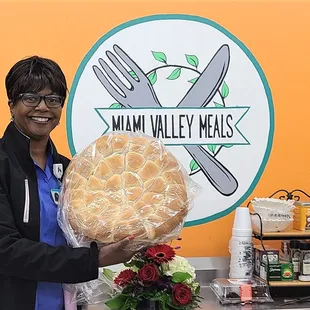 Baker preparing to deliver meals and dinner rolls to families in need.