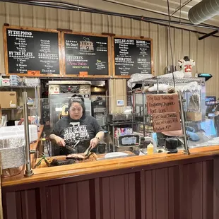 a woman behind the counter