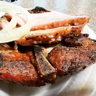 a plate of meat and pickles