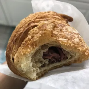 a croissant with meat inside