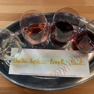 three glasses of wine on a tray