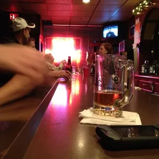a glass of beer on the bar