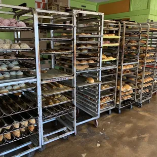 racks of doughnuts in a bakery