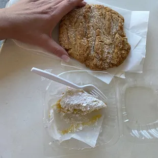 Peanut butter cookie and lemon bar, my hand for scale.