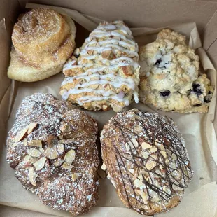 Box of cinnamon roll, scones and croissants