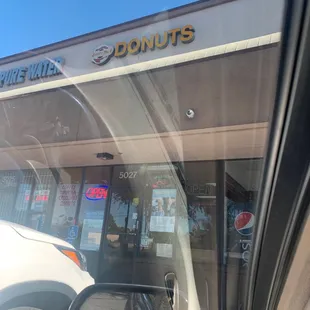 a view of the outside of a donut shop