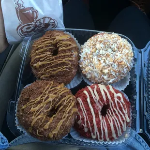 Two peanut butter cronuts,red velvet, and coconut cronut.