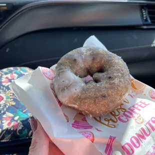 a person holding a doughnut