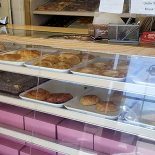 a display case filled with pastries