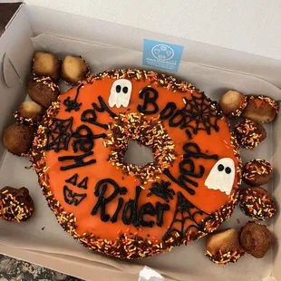 a decorated donut in a box