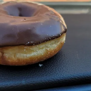 a chocolate frosted donut