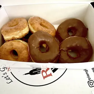 Raised donuts -- Glazed and chocolate icing.