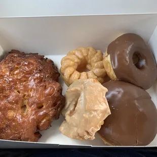 Apple fritter on the far left plus some other donuts