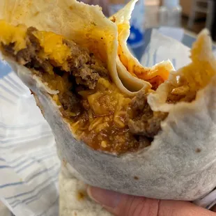 Ground beef combination burrito xtra beef,cheese,red sauce.