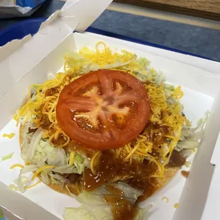 Bean tostada with hot sauce.