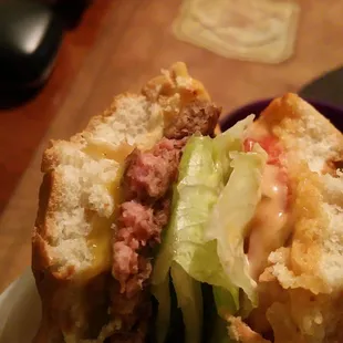 Raw meat I took half the lettuce out...gross burger