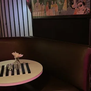 a table with a vase of flowers on it