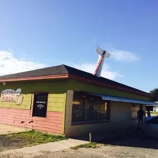 The novelty plane tail sticking out of the roof, is the signal you have found it!