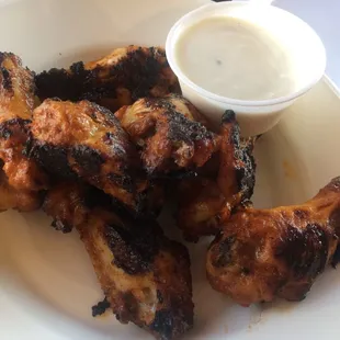 The sign says Pizza, but dem wings tho!