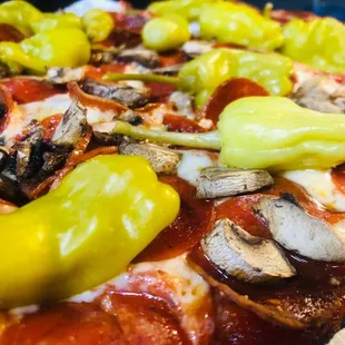pepperoni, mushrooms, and peppers