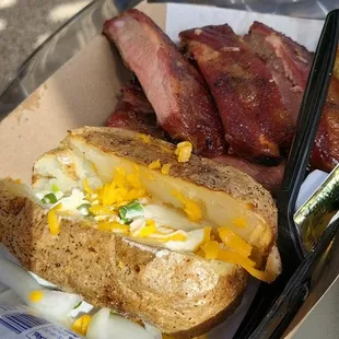 Ribs and stuffed baked potato
