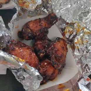 chicken wings wrapped in tin foil