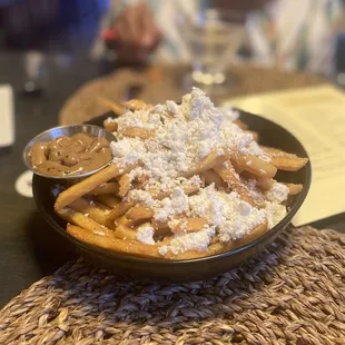 a plate of waffles with powdered sugar on top