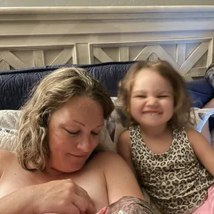 A newborn nursing with big sister watching. I caught both of these babies. A total for four babies i have helped this particular mom with.