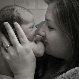 Mama enjoying her sweet baby.