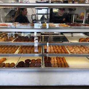 a display case filled with donuts