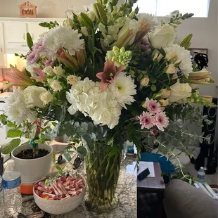 Large sympathy bouquet with soft pops of color. Another great suggestion with excellent delivery.