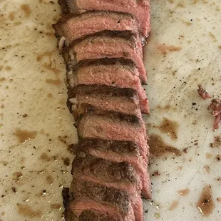 Sliced strip portion of the Hammon's amazing porterhouse!!  Super juicy and tender!! They have the most outstanding quality beef here!