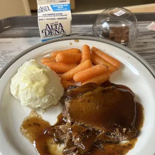 Bomb pot roast, mashed potatoes with gravy, and carrots