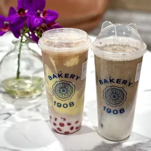 Milk Tea with custard and pink boba/ Sesame Milk tea with boba and red bean