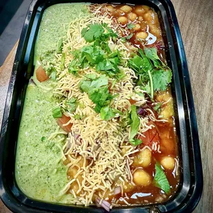 Samosa Chaat... a savory blend of samosa pieces topped with tangy chaat spices. (One of my favorite dishes here!)