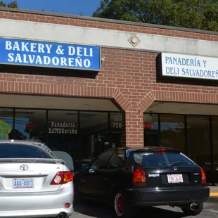 cars parked in front of a bakery