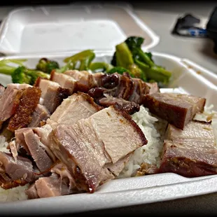 Roast pork over rice. Great dish, but their veggies are ALWAYS the champion of their dish. (Different veggie each day.)