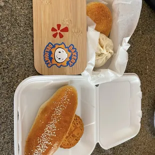 (Left) baked pork bun, steamed bun, coconut bun, moon cane (right)