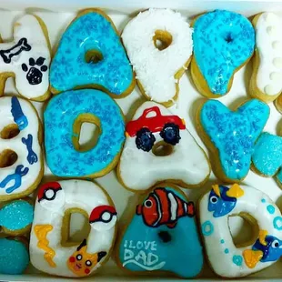a box of decorated donuts