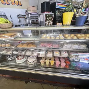 a display case filled with pastries