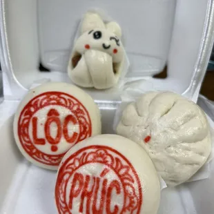 Full bao (2 bao that states &quot;Phuc Loc&quot; has mung bean coconut fillings), cha sui bao, and bunny bao (sausage)