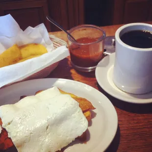 Some empanadas and and order of fried plantains with cheese. About $8 with coffee.