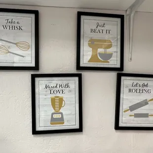 four framed posters on a wall