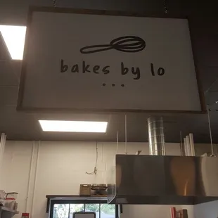a sign above a kitchen