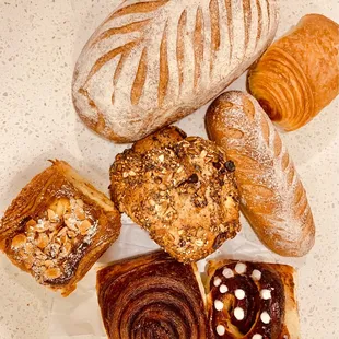 Cinnamon babka, almond babka, apple babka, Swedish seedy roll, baguette and wheat bread