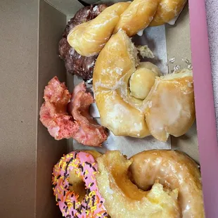 Strawberry frosted, strawberry cake, strawberry fritter, glazed, sour cream, cronut, and twist glazed.