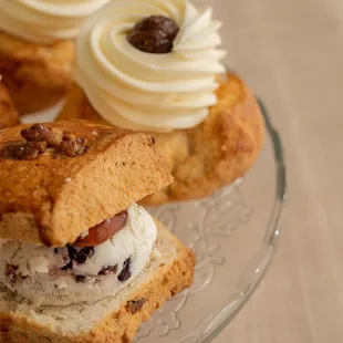 Special scone with homemade fig jam and cream and Cranberry cream cheese and rasberry jam,