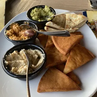 Triple Dip appetizer with hummus, cilantro-jalapeno hummus, &amp; fiery Fire Feta Dip