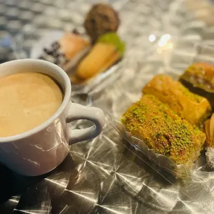 a cup of coffee and pastries