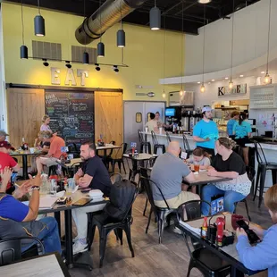 a large group of people eating